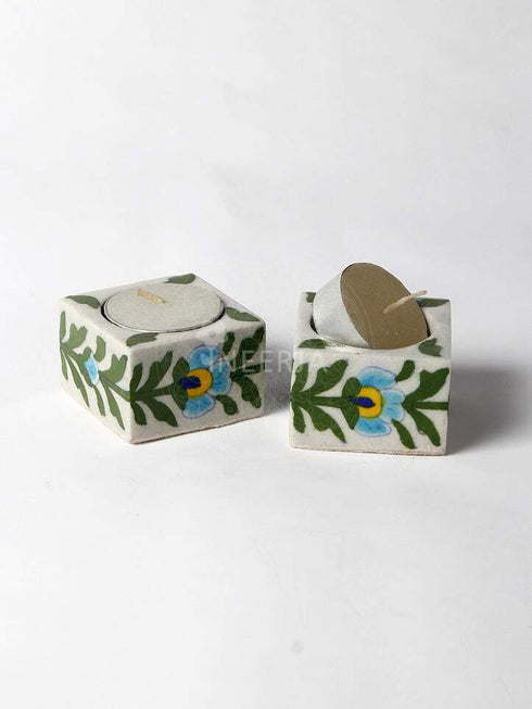 Turquoise Flower With Green Leaves on White Base
